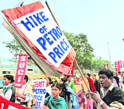 SUCI activists protest against petrol price hike in Kolkata on Wednesday.
