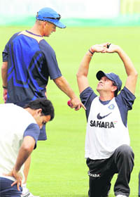 Sachin Tendulkar (R) chats with coach Gary Kirsten during training at the SuperSport Park in Centurion.
