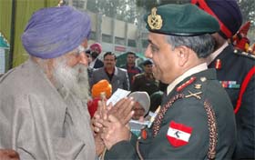 Lt-Gen Sanjiv Chachra, GOC, Chetak Corps, interacting with a war veteran during the War Veterans Meet organised at Bathinda Cantonment on Thursday.