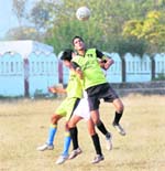 A match in the Shivalik Football Cup Tournament in progress in Dehradun on Thursday.