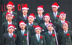 Students participate in the carol-singing ceremony at Carman School in Dehradun on Wednesday. 