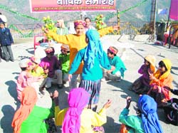 Students dance on the annual day of Garhwali English Medium School near Mussoorie on Wednesday.