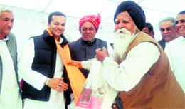MP Naveen Jindal is presented a robe of honour by people of the Siwan area of Kaithal district
