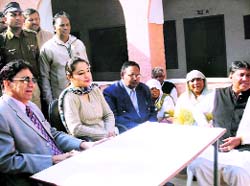 RS Baswana, district and sessions judge, Kaithal, ACJM Reetu YK Behal and others during a lok adalat held at Bata village in Kaithal district