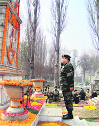 VIJAY DIWAS: Lt-Gen S.A.Hasnain,GOC,15 Corps, gives a salute at the Corps War Meorial in Srinagar on Thursday. 