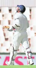 Virender Sehwag walks back dejected after being caught out for a duck at Super Sports Park in Centurion on Thursday