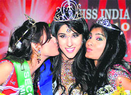 Miss India USA winner Natasha Arora of Texas flanked by first-runner up Rafeiya Hussain (R) and second runner-up Shreya Sood in New Jersey, recently.