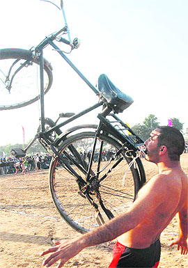 A man lifts a bicycle during the 19th Kabbadi Cup organised by the Paindu Sports and Welfare Club Kumbra at Dasehra ground in Phase VII, Mohali, on Friday. Tribune photo Vicky Gharu