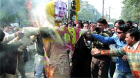 BJP activists burn the effigy of Delhi CM Sheila Dikshit against the misrule of the Delhi government near Town Hall, Chandni Chowk, in Old Delhi on Friday.