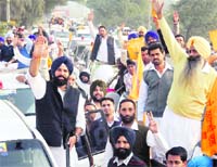 Bikram Singh Majithia waves to supporters in Bathinda on Friday. 