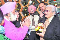 Kumud Joshi, chairperson, KVIC, (RIght) unveiling the foundation stone of Punjabi Desi Jutti Cluster at Rampura village in Fazilka sub-division on Friday. 