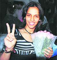 Saina Nehwal is all smiles after winning the women's singles final at the Hong Kong Open Badminton Super Series in Hong Kong 