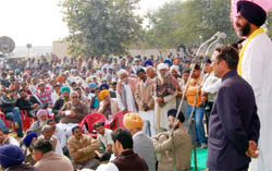 Manpreet Singh Badal addresses a rally at village Khuyiansarwar on the Abohar- Sriganganagar road 