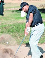 Paul Dhaliwal from Los Angels plays a shot during the NRI Golf Tour on Saturday. 