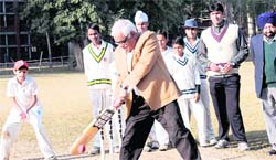 Punjab and Haryana High Court Judge Mukul Mudgal plays a shot to inaugurate the Haier Cup Cricket Tournament at Sector 19 in Chandigarh on Saturday.