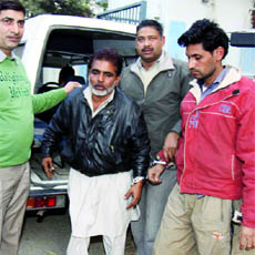 The two accused in police custody in New Delhi on Saturday.