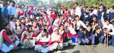 Students of Government High School, Kheral in Reasi district, block the National Highway in protest against the shortage of teachers and lack of drinking water facility on Saturday. 