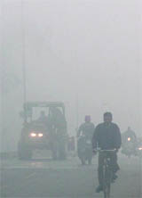 Dense fog compels drivers to switch on the headlights on the Jalandhar-Amritsar road
