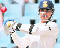 Virender Sehwag plays a shot off the bowling of Morne Morkel on the third day of the first Test at SuperSport Park in Centurion