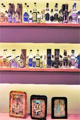 In this file photo, Ouzo bottles of different producers are on display at the traditional Lesbos products shop in the town of Mytilini on the Aegean island of Lesbos.