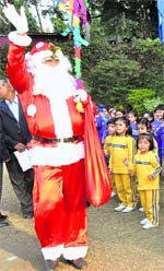 Santa Claus waves to students on the annual sports day at Strawberry Fields School in Chandigarh on Sunday.
