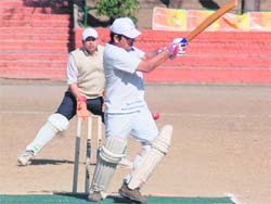 A batsman tries to hit the ball in a friendly match between SJA Lions and SJA Tigers in Dehradun on Sunday.