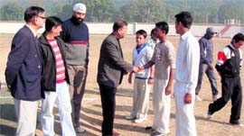 Officials of the Cricket Association meet cricketers prior to the start of the Inter School Cricket Tournament in Haridwar on Sunday.
