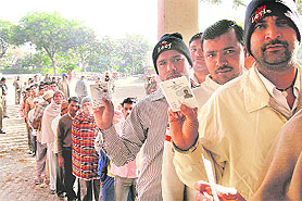 Voters stand in a queue to cast their ballot in the MC poll in Kaithal on Sunday. 