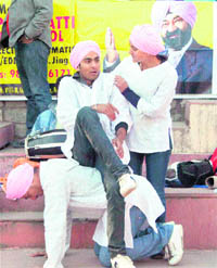Students stage a play, Kahin Der Na Ho Jaye, on breast cancer awareness in Shimla on Sunday.