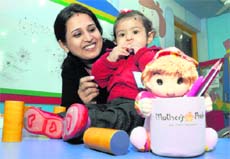 A tiny tot with her mother at the baby show of Mothers Pride Pre-School in Ludhiana. 