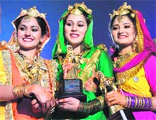 Arshdeep Gosal (centre) from Canada who won the Miss Punjaban title, flanked by runners up Navreet Kaur (left) from the US and Harpreet Kaur from Ropar, in Ludhiana on Saturday night.