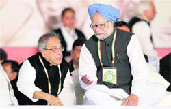 Prime Minister Manmohan Singh with Finance Minister Pranab Mukherhjee at the 83rd plenary session of the Congress in New Delhi on Monday.
