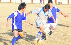 A match in the Shivalik Trophy Football Tournament being played at Survey of India grounds in Dehradun on Monday.