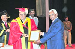 Chief Minister Bhupinder Singh Hooda honours Dr CK Yadav.