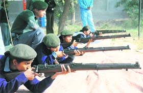 NCC cadets fire at the target during the annual training camp-2010 in Karnal.