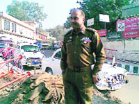 HK Lohia, IG, Traffic, waits for Engineering Department officials in Jammu on Monday.
