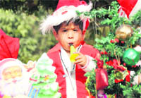 A student of Chanda Mama School dressed as Santa Claus to celebrate Christmas in Ludhiana 
