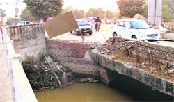 The safety rail is missing along a portion of a bridge on the Sidhwan canal in Ludhiana. 