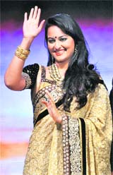LONG STRIDE: Actor Sonakshi Sinha walking the ramp during a fund raiser in Ahmedabad recently.
