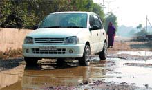 Area of neglect: Full of potholes, this stretch of the road in the New Amritsar locality gets inundated whenever it rains. 