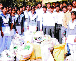 Students with polythene bags collected by them as part of a campaign in Haridwar. 