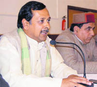   Puneet Mittal, Dehradun BJP president, addresses a press conference in Dehradun on Tuesday.