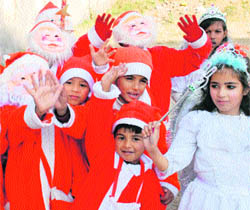 Children of Alexandria School celebrate Christmas on the school campus in Jammu on Tuesday.