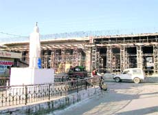 A view of the flyover being constructed in the vicinity of veteran leader Girdhari Lal Dogras statue in Hiranagar town on the Jammu-Pathankote National Highway. 