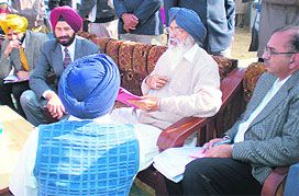 Chief Minister Parkash Singh Badal interacts with people in Ghudda village in Bathinda district on Tuesday. 