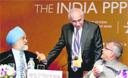 Finance Minister Pranab Mukherjee with Planing Commision Deputy Chairman Montek Singh Ahluwalia and Finance Secretary Ashok Chawla at the India PPP conclave in New Delhi on Wednesday.