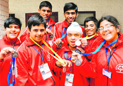 Special children in a jubilant mood after winning silver medal in the floor hockey at Sector 27, Chandigarh, 