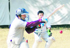 A batsman tries to hit the ball during a match in the Beehive Challenger T20 Cricket Tournament in Dehradun on Wednesday.