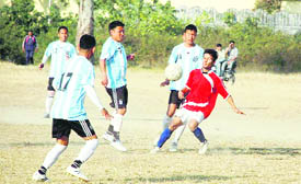 A match in the Manvendra Singh Memorial Football Tournament being played at the Survey of India grounds in Dehradun on Wednesday.