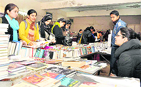 Students at a book fair in Dehradun on Wednesday. 
